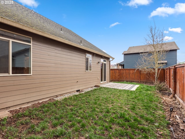 view of yard with a fenced backyard