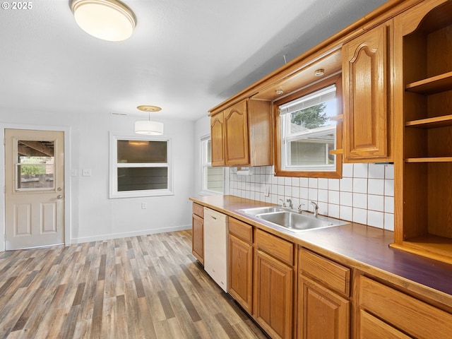 2745 SW 187th Ave, Beaverton, OR 97003 - kitchen with white dishwasher, decorative backsplash, light wood-type flooring, and healthy amount of natural light