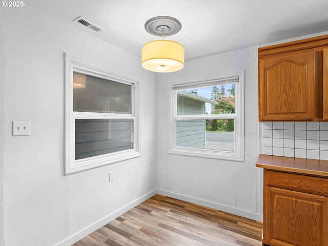2745 SW 187th Ave, Beaverton, OR 97003 - unfurnished dining area with light wood-style floors and baseboards