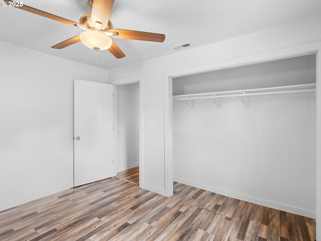 2745 SW 187th Ave, Beaverton, OR 97003 - unfurnished bedroom with a closet, wood finished floors, and ceiling fan