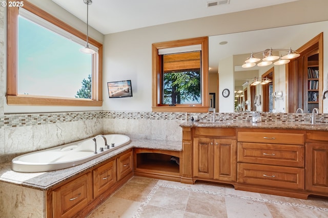 1209 NW 80th St, Vancouver, WA 98665 - bathroom with a garden tub, double vanity, and backsplash