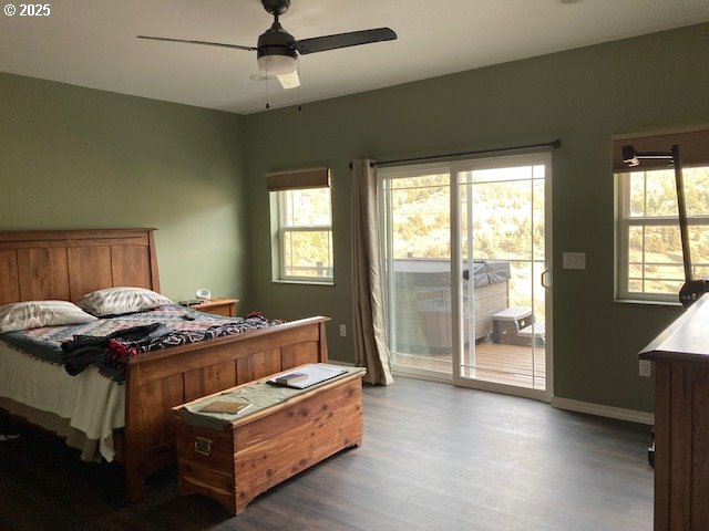 bedroom with access to exterior, hardwood / wood-style flooring, and ceiling fan