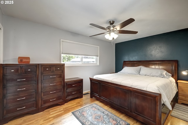bedroom featuring a ceiling fan and light wood-type flooring