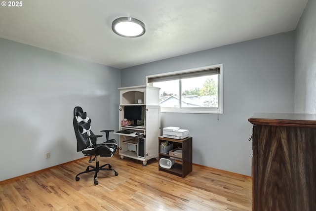 office with light wood-style floors
