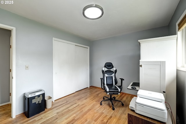 home office featuring light wood-style floors
