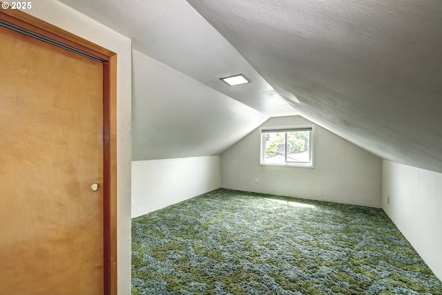 bonus room featuring carpet and lofted ceiling