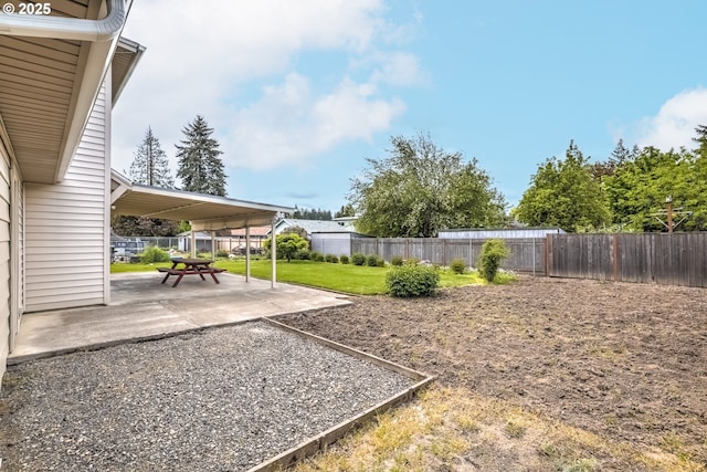 view of yard featuring a patio and a fenced backyard