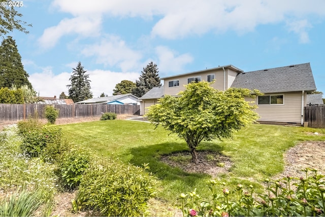 view of yard with a fenced backyard