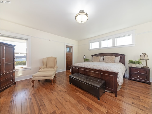 bedroom featuring dark wood-type flooring