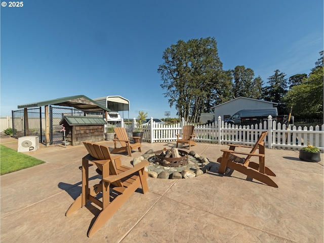 view of patio / terrace with an outdoor fire pit