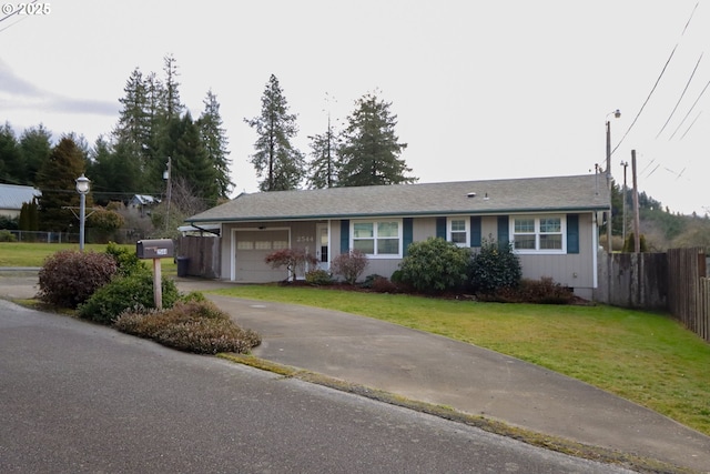 ranch-style house featuring a garage and a front lawn