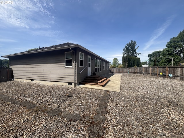 99 Rainbow Way, Kelso, WA 98626 - view of property exterior featuring crawl space, a fenced backyard, and entry steps