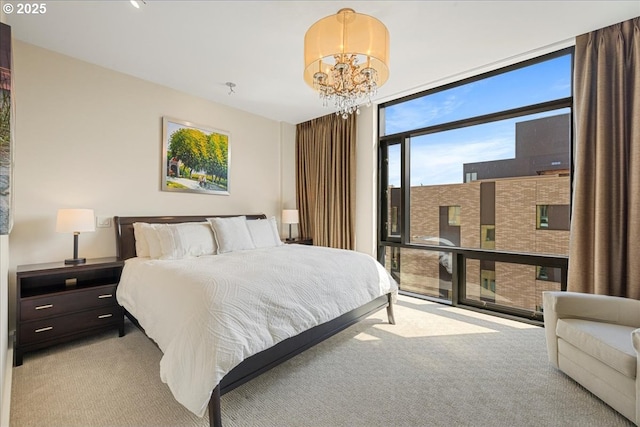 311 NW 12th Ave Unit 602, Portland, OR 97209 - bedroom with floor to ceiling windows, light carpet, and a chandelier