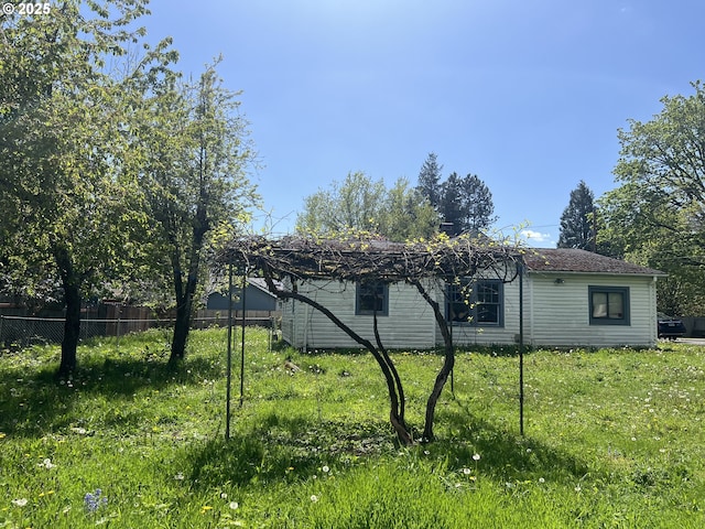 view of property exterior with fence