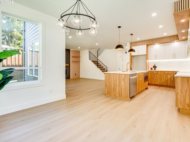 5412 NE 111th St, Vancouver, WA 98686 - kitchen with appliances with stainless steel finishes, light wood-style flooring, light countertops, pendant lighting, and open floor plan