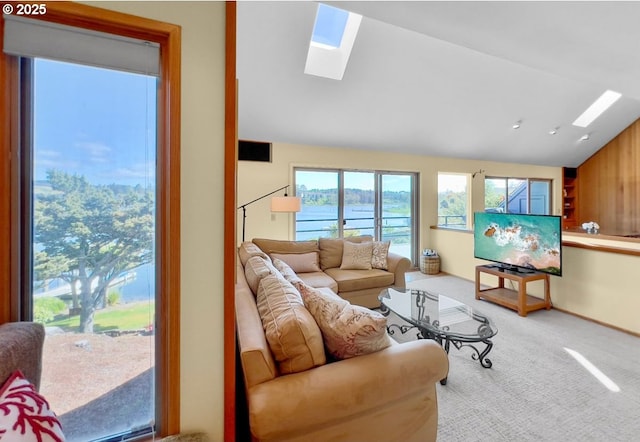 2036 NE Lagoon Ln, Lincoln City, OR 97367 - carpeted living room with a skylight and vaulted ceiling