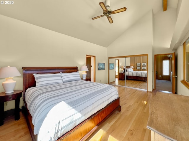 2036 NE Lagoon Ln, Lincoln City, OR 97367 - bedroom with high vaulted ceiling, a closet, light wood-style flooring, and ceiling fan