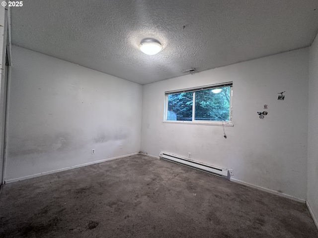 unfurnished room with a textured ceiling, carpet, baseboards, a baseboard heating unit, and visible vents