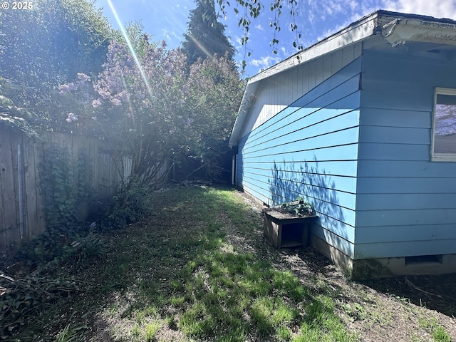 view of side of property with fence