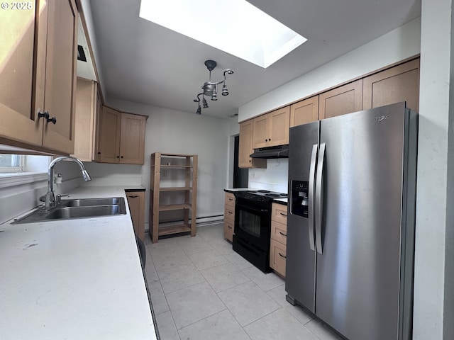 kitchen featuring a sink, black range with electric cooktop, under cabinet range hood, stainless steel refrigerator with ice dispenser, and a skylight