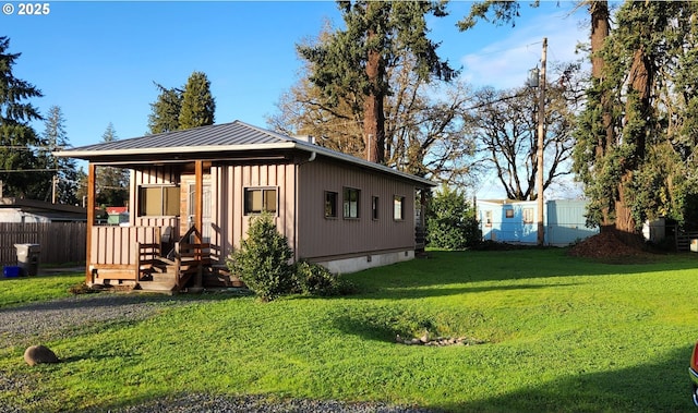4395 E 20th Ave, Eugene, OR 97403 - view of front of house with crawl space, metal roof, a standing seam roof, and board and batten siding
