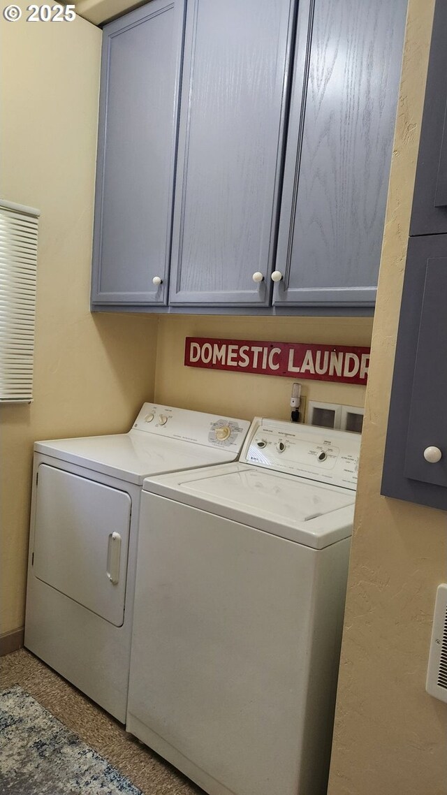 4395 E 20th Ave, Eugene, OR 97403 - washroom featuring cabinet space and independent washer and dryer