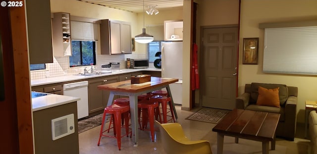 4395 E 20th Ave, Eugene, OR 97403 - kitchen featuring white appliances, a sink, tasteful backsplash, and light countertops