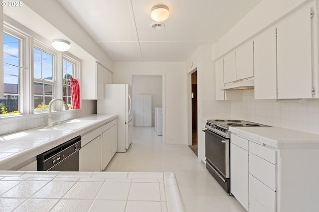 3034 Fisher Rd, Roseburg, OR 97471 - kitchen with electric range oven, dishwasher, backsplash, a sink, and white cabinetry