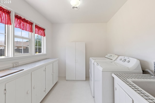 3034 Fisher Rd, Roseburg, OR 97471 - laundry area featuring washer and clothes dryer and cabinet space