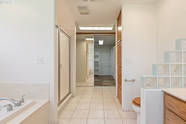 3034 Fisher Rd, Roseburg, OR 97471 - full bathroom featuring a stall shower, tile patterned floors, toilet, a garden tub, and vanity