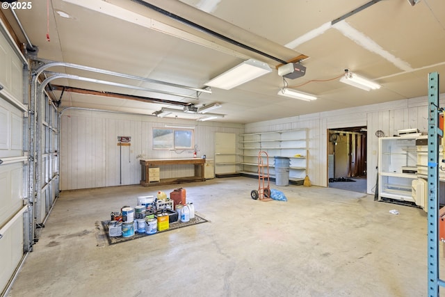 3034 Fisher Rd, Roseburg, OR 97471 - garage with wooden walls and a garage door opener
