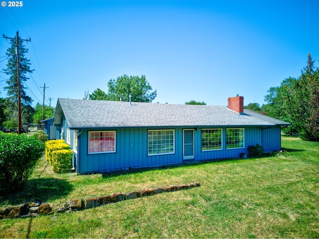 3034 Fisher Rd, Roseburg, OR 97471 - ranch-style house with a shingled roof, a front lawn, a chimney, and board and batten siding