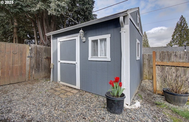 view of shed featuring a fenced backyard