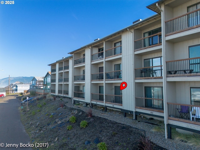 view of building exterior with a mountain view