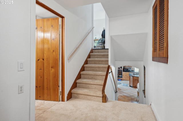 staircase with carpet floors