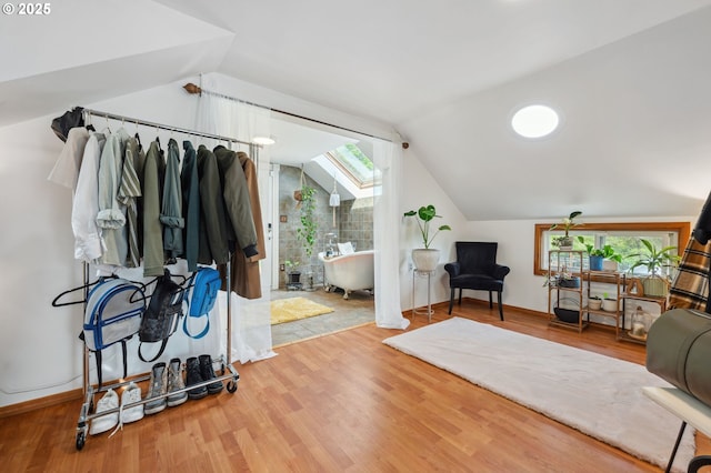 interior space featuring lofted ceiling and wood-type flooring