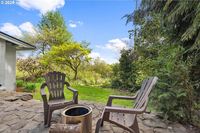 view of patio / terrace featuring an outdoor fire pit