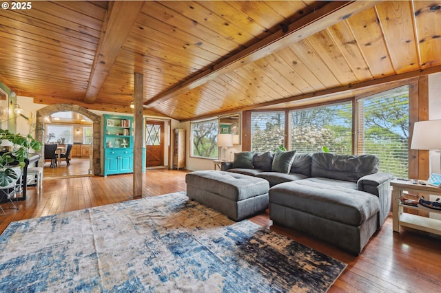 living room featuring wood ceiling, vaulted ceiling with beams, and wood-type flooring