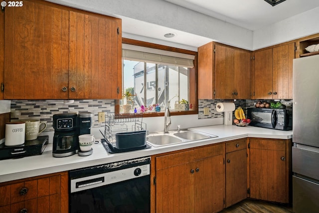 4435 Hazelgreen Rd NE, Salem, OR 97305 - kitchen with black appliances, light countertops, a sink, and backsplash