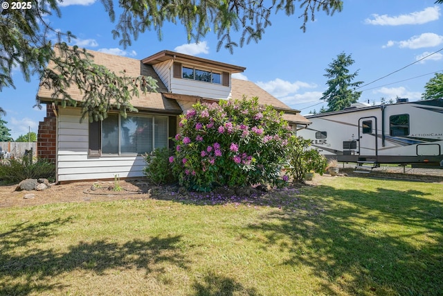 4435 Hazelgreen Rd NE, Salem, OR 97305 - view of front of home with a front yard and roof with shingles
