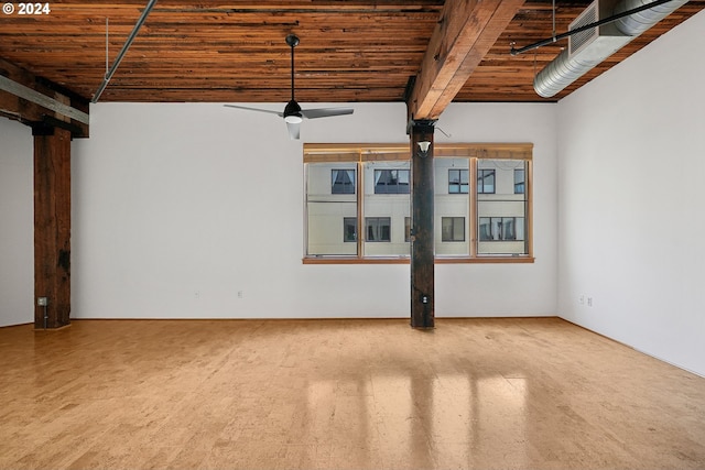 spare room with ceiling fan, wood ceiling, and beam ceiling