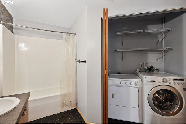 washroom featuring washer and dryer and sink