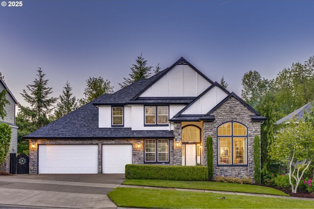3011 Sabo Ln, West Linn, OR 97068 - view of front of home featuring stone siding, driveway, a shingled roof, an attached garage, and a front yard