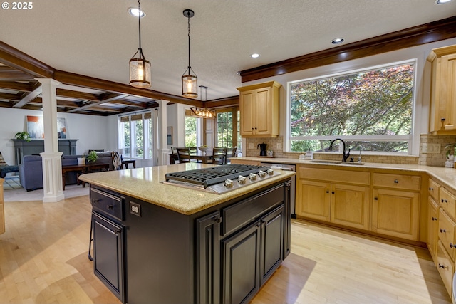3011 Sabo Ln, West Linn, OR 97068 - kitchen with decorative columns, a sink, light brown cabinets, stainless steel gas stovetop, and recessed lighting