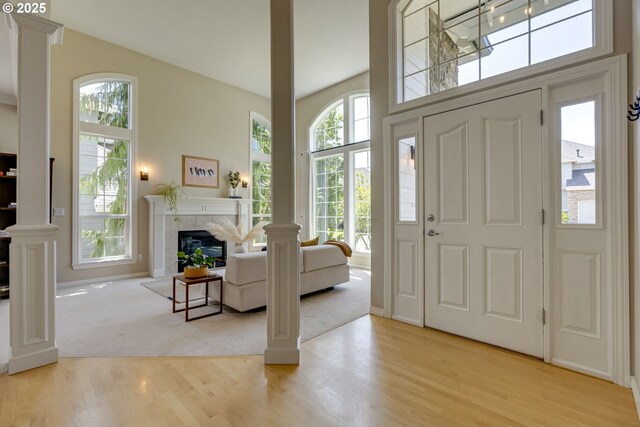 3011 Sabo Ln, West Linn, OR 97068 - entryway featuring light wood-style flooring and a fireplace