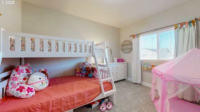 carpeted bedroom with baseboards