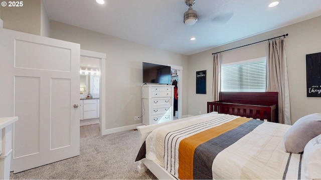 bedroom featuring ensuite bath, recessed lighting, carpet flooring, and baseboards