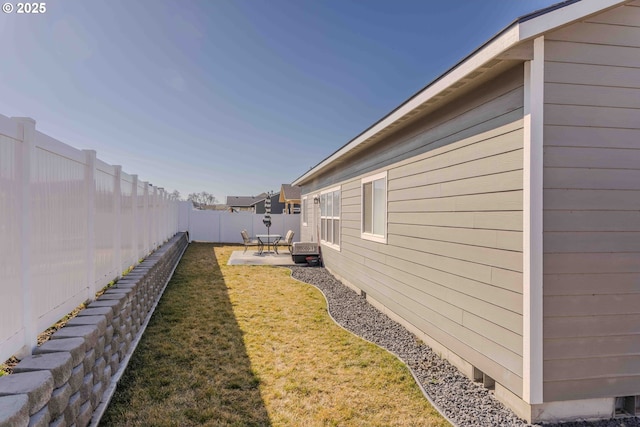 view of yard with a patio area and a fenced backyard