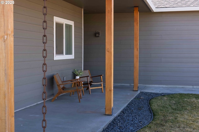 doorway to property with roof with shingles