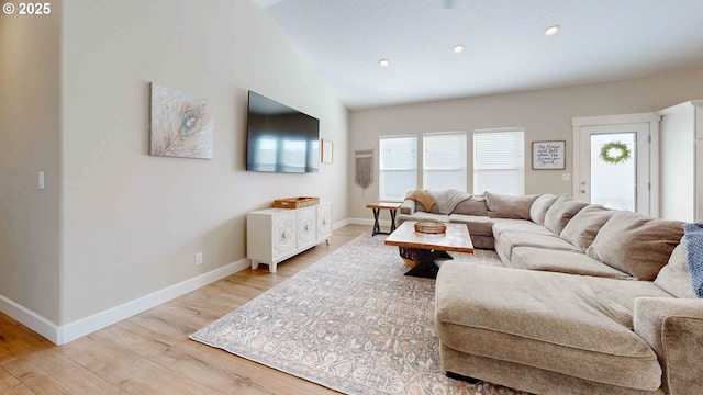 living area featuring light wood finished floors, recessed lighting, and baseboards